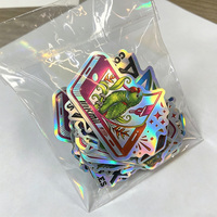 Autocollants en vinyle holographique personnalisés, effet 3D gaufré, revêtement UV, estampage à chaud doré, impression couleur premium, fabricant