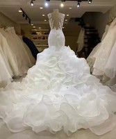 Robe de reine africaine 2025 en dentelle brodée de perles de luxe | Illusion voir à travers le dos et la queue de poisson à volants en cascade pour les mariées royales