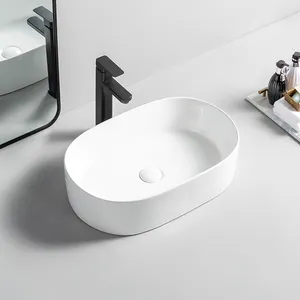 Baskom-lavabo de cerámica ovalado para baño, lavamanos montados sobre encimera, venta al por mayor