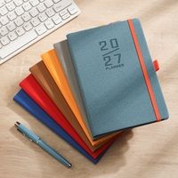 Agenda de bureau 2027 : Carnet de notes avec plan de la semaine, couverture rigide et sangle, design élégant