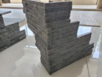 Revêtement mural extérieur UnionStone en pierre naturelle noire de haute qualité, moderne, durable et écologique, avec surface fendue