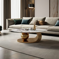 Meubles de salon de luxe Nodric, table basse ronde moderne en acier inoxydable avec plateau en marbre ardoise et métal doré pour usage hôtelier