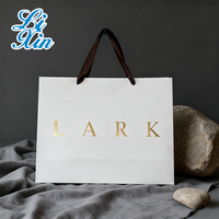 Sacs cadeaux de luxe personnalisés écologiques avec poignées en ruban, emballage en papier rose pour vêtements