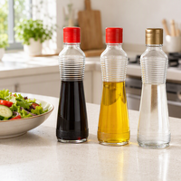 Bouteille en verre transparent pour huile et vinaigre avec bouchon métallique hermétique, idéale pour les assaisonnements et sauces de cuisine (vente en gros)