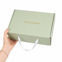 Maßgefertigte Rosa Wellpappe-Versandbox mit Bandgriff Goldfolien-Logo Recycelbare Versand-Geschenkverpackung für Kosmetik Schuhe Hüte
