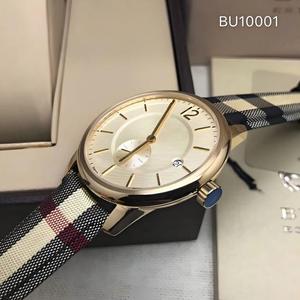 Reloj de Pulsera de Nylon de Lujo Hecho a Mano con Correas Intercambiables de Colores, Movimiento de Cuarzo, Caja de 5mm de Grosor, Analógico, Tela Dorada - Product Image 1