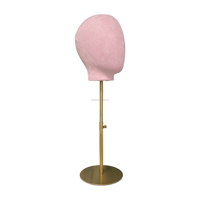 Tête de mannequin femme en fibre de verre rose de luxe avec pose debout pour la présentation visuelle en magasin