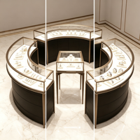 Ensemble de vitrine à bijoux incurvée, cadre en métal or champagne, dessus en verre trempé, base de rangement noire, éclairage LED, îlot à bijoux complet
