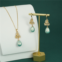 Nouvel ensemble de colliers pendentifs en perles en gros, bijoux en alliage plaqué or 14 carats de Chine, pour cadeaux de fiançailles et fêtes, style hawaïen