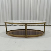 Table basse ovale en marbre avec base en acier inoxydable doré et étagère de rangement
