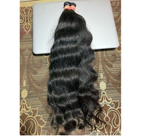 Extensions de cheveux humains à donneur unique indien brut pur naturel ondulé bouclé avec alignement des cuticules non transformés approvisionnement en gros