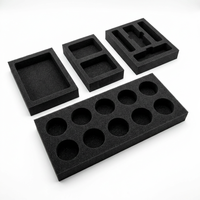 Plateau en mousse noire poreuse, support en mousse souple multi-crevasses percé sur mesure pour la protection des flacons d'échantillons et des petits flacons cosmétiques