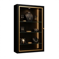 Maßgefertigte Wandmontierte LED-Schmuckvitrine Schwarz-Gold Glasvitrine für Juweliergeschäfte