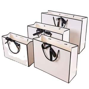 KM Recyclable Low Price Retail Boutique Luxury Shopping Gift Paper Bags with Bow Tie Ribbon Handle - Product Image 1