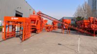 Ligne de production automatique de blocs de ciment contrôlée par PLC QT15-15, à pression hydraulique, haute rigidité, polyvalente pour pavés et blocs de bordure