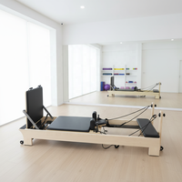 Reformer de Pilates professionnel en bois d'érable avec système de barre de pieds réglable intégré et cadre en bois d'érable plus épais