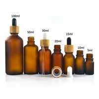 Botol Kaca Kosong Grosir OEM Amber Biru Hijau Leher Sekrup Kapasitas Kustom Botol Kosmetik untuk Pengisian Minyak Esensial