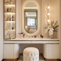 Table de maquillage moderne de luxe avec miroir arqué LED, bureau de coiffeuse personnalisé pour chambre à coucher avec tiroirs de rangement et armoire en verre