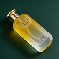 Vente en gros de flacons de parfum en verre transparent cylindriques personnalisés de 50 ml, 70 ml, 100 ml avec atomiseur et pompe