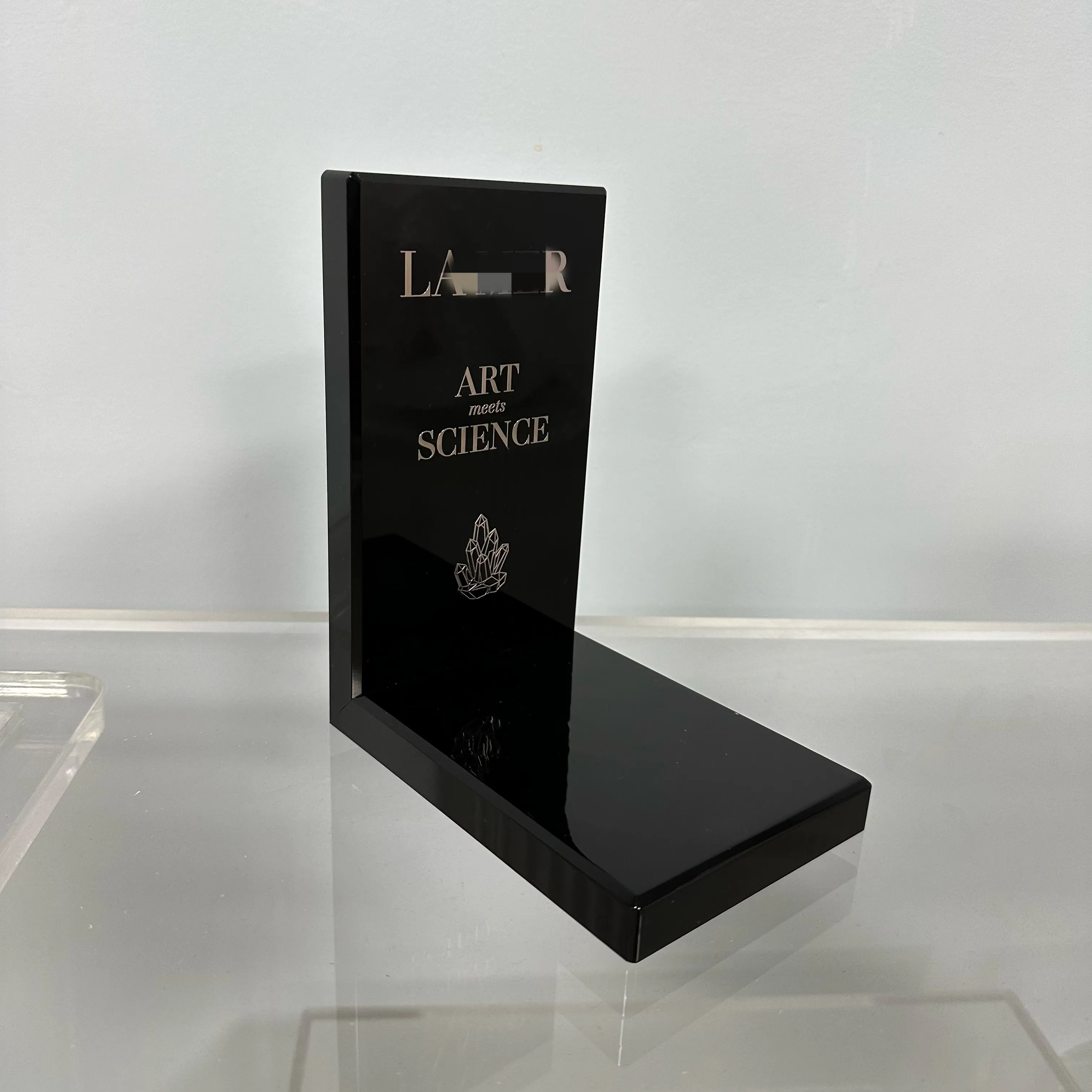 High Quality Luxury Black Acrylic Display Stand With Custom Silver Logo