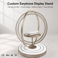 Support d'affichage rotatif haut de gamme pour écouteurs avec cadre métallique, personnalisation de la marque, anneau lumineux LED et base en acrylique pour écouteurs sans fil – Présentoir de vente au détail