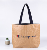 Sac fourre-tout en papier écologique étanche Dupont Tyvek Sac à bandoulière léger Logo personnalisé Lumière de luxe pour Shopping Travail Quotidien Extérieur