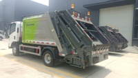 Camion à ordures Isuzu 4x2 manuel personnalisé pour l'exportation, 7 m³ de capacité, compacteur de déchets à chargement arrière de haute qualité, haute efficacité