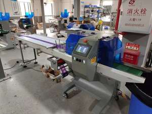 Máquina de embalaje horizontal de panadería promocional Máquina de embalaje de flujo de tira continua Máquina de embalaje de flujo tipo almohada Pequeña - Product Image 4