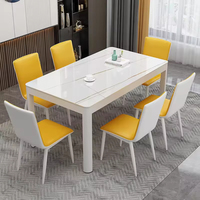 Ensemble de salle à manger moderne et minimaliste noir, pieds en fer, plateau en pierre frittée, écologique, durable, 6 places, pour salon