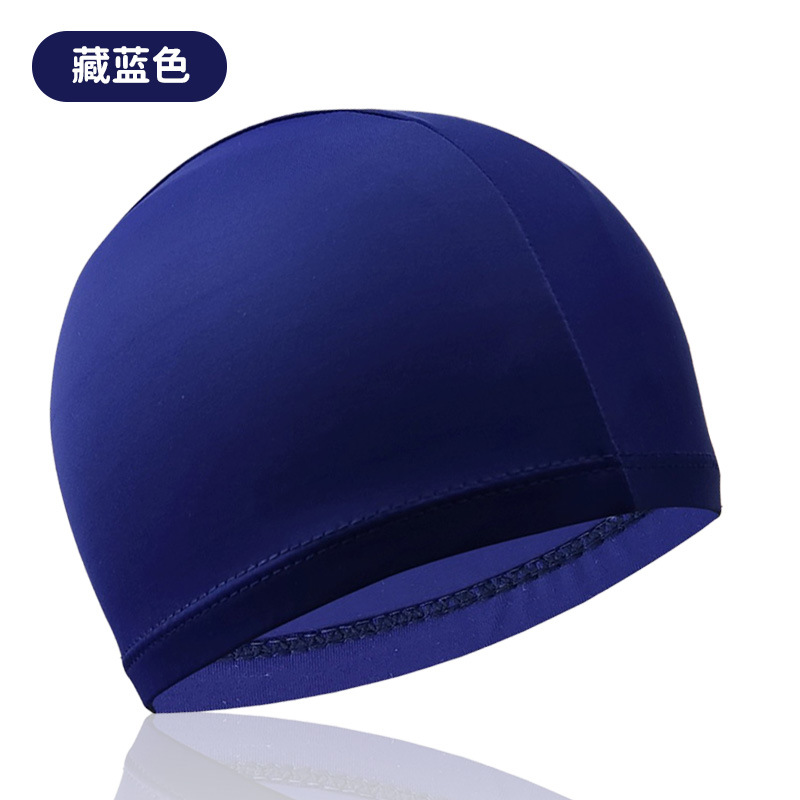 Azul marino, muy elástico y cómodo, no impermeable.