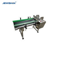 Machine de pagination automatique avec régulation de vitesse à fréquence variable pour l'alimentation de cartes et de cartons