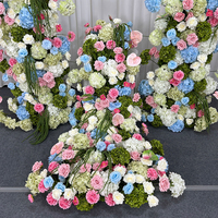 Backdrop lengkung bunga sutra buatan tangan dengan desain pastel pink, biru, dan putih, sempurna untuk dekorasi latar belakang tempat pernikahan