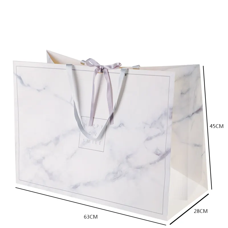 Fantezi yaratıcı beyaz mermer kağıt torba OEM tasarım özel logo lüks kağıt alışveriş çantası kolları ile giyim için