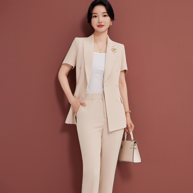 Beige suit trousers brooch