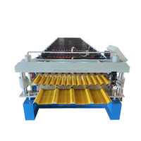Machine de formage à froid de panneaux de toiture et de paroi en acier double couche
