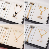 Nouvel ensemble tendance plaqué or : collier, bracelets, boucles d'oreilles et bagues (trois pièces) pour femme, idéal pour mariage ou fête, cadeau de bijoux