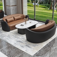 Ensemble de canapés commerciaux haut de gamme en cuir noir et marron avec table basse en marbre, mobilier pour hall d'hôtel