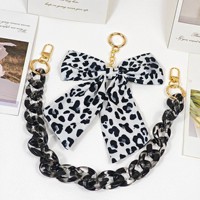 Chaîne de sac pour femme en gros, accessoire de mode avec pendentif nœud en acrylique