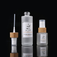 Vente en gros de flacons vaporisateurs en verre mat écologiques de 50 ml, flacons vaporisateurs fins pour parfum avec couvercle en bambou