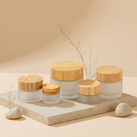 Pot en verre de luxe vide de 30g, 50g, 100g pour masque facial, crème capillaire, avec couvercle en bambou pour emballage de produits de soin de la peau