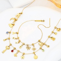 Collier Pendentif FY Fashion Jewelry Élégant en Acier Inoxydable Personnalisable avec Breloques Cœur, Croix, Étoile de Mer, Nœud Papillon, Trèfle et Fleur