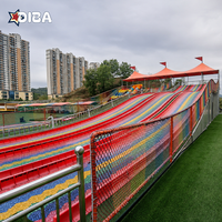Équipement de terrain de jeux personnalisé multi-voies, toboggan arc-en-ciel long pour les stations touristiques et les parcs à thème