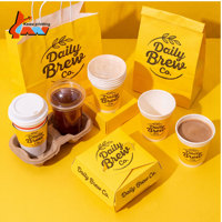 Ensemble d'emballages jaune vif pour café, avec tasses, sacs, boîtes alimentaires, pailles et design du logo Skyline Urbain, pour l'image de marque des chaînes de cafés