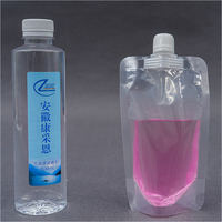 Pochettes souples personnalisées en plastique givré transparent avec bec verseur et bouchon à vis pour liquides