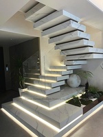 Escalier flottant de style américain avec poutre en acier dissimulée, marches en marbre, design d'escalier flottant
