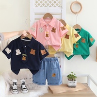 Petit garçon été nouvel ensemble dessin animé revers à la mode à manches courtes deux pièces ensemble bébé mignon ensemble en gros