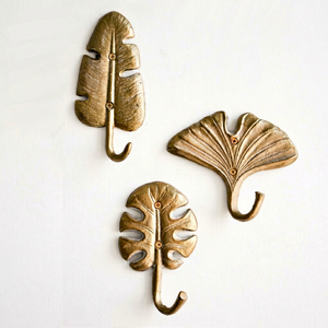Ganchos de pared con diseño de hojas tropicales, de metal color dorado, resistentes al óxido, perchero de un solo nivel para decoración del hogar. - Product Image 1