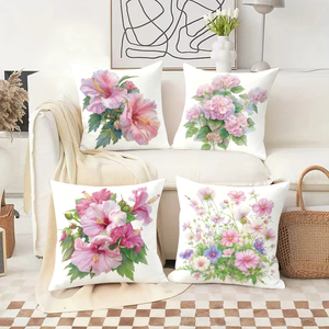 Floral throw pillows adorn cozy sofa with festive stockings and reindeer antlers in holiday decor scene - Product Image 2