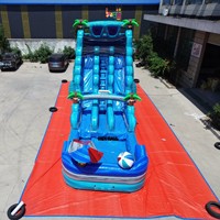 Structure gonflable commerciale double toboggan aquatique et château sauteur pour locations événementielles, avec conception robuste