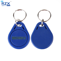 Porte-clés RFID étanches 13,56 MHz FM11RF08 prêts à être expédiés pour système d'accès aux portes, porte-clés RFID en plastique avec puce